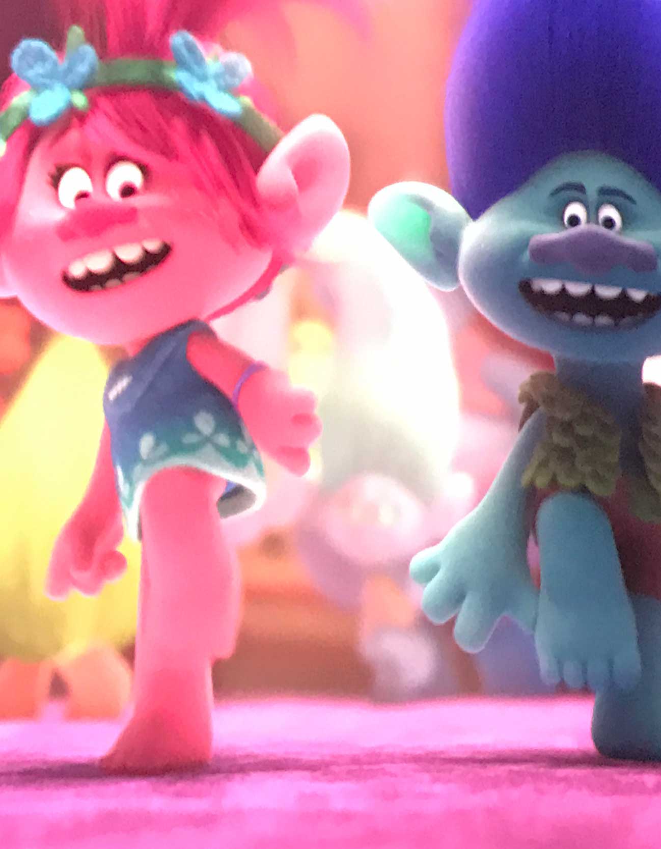 A coup of coffee on a table with two chairs